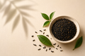 Existence Brewed Ritual loose-leaf English Breakfast black tea in a bowl with scattered tea leaves.